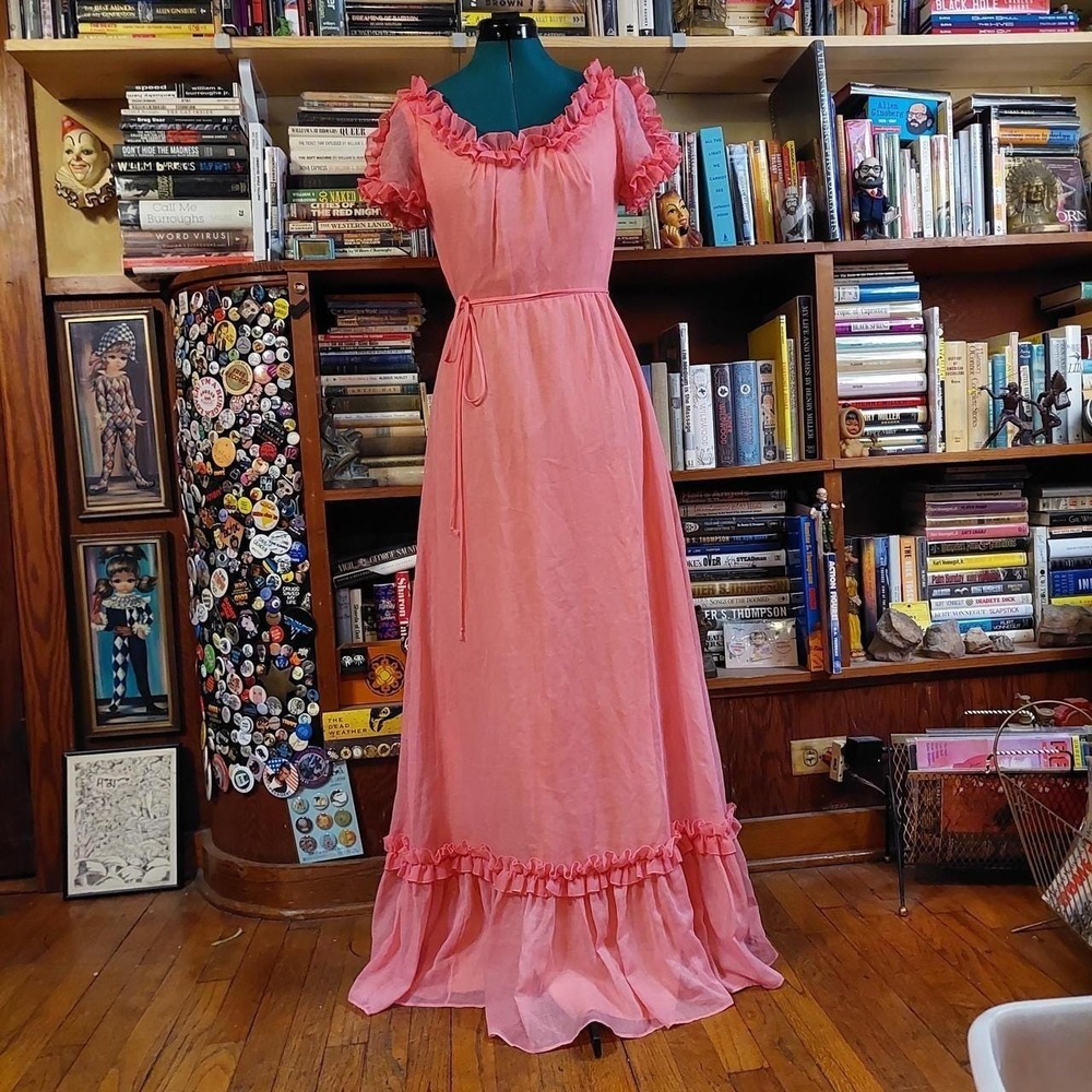 Vintage pink maxi dress with ruffle detail.